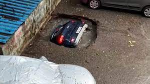 car in a sink hole